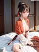 A woman in a kimono sitting on a bed.